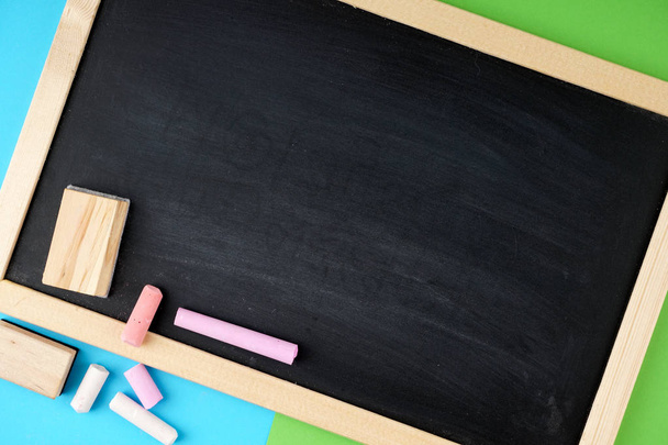 empty space on black board and colorful chalks  - Φωτογραφία, εικόνα