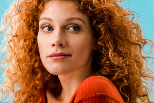 portrait of attractive redhead woman isolated on blue - Valokuva, kuva