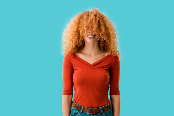 portrait of beautiful redhead smiling girl isolated on blue - Фото, изображение