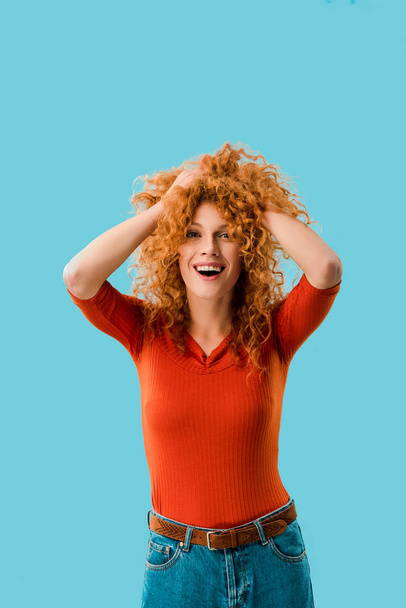 portrait of excited redhead girl isolated on blue - Fotoğraf, Görsel
