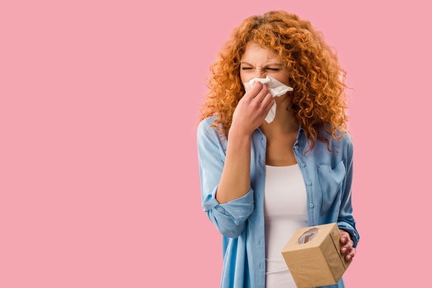 redhead woman crying with paper napkins, Isolated On pink - Photo, Image