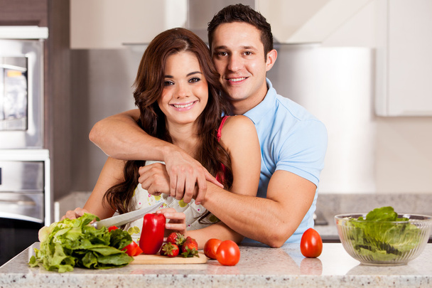 Couple making a salad together - Фото, зображення