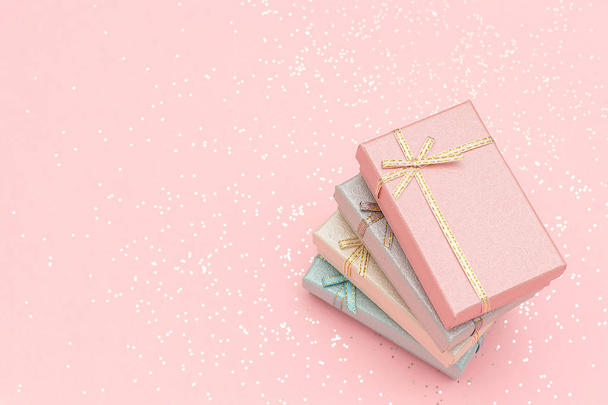 Pile gift boxes of pastel colors on pink background - Foto, immagini