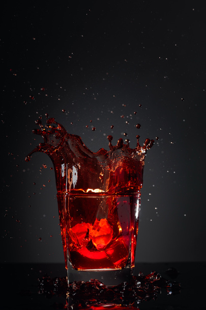 Cola glass with lemon and falling ice cubes. - Photo, Image