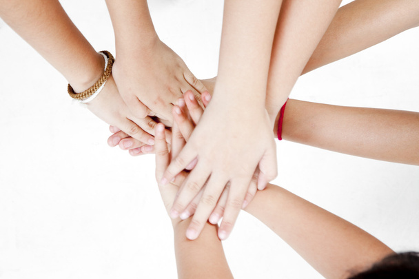 Asian children's hands together on a white background - Foto, imagen