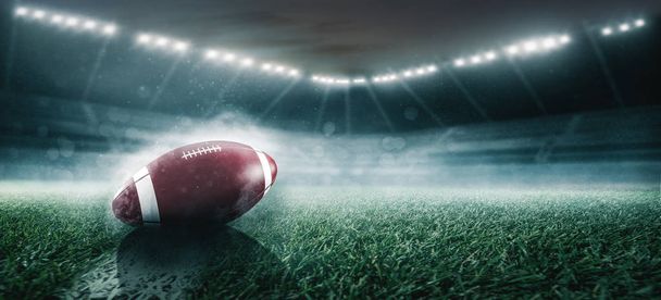 rugby ball on stadium field with lights - Photo, Image