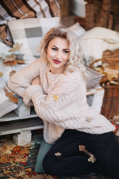 beautiful blond  woman with makeup in white sweater - Foto, immagini
