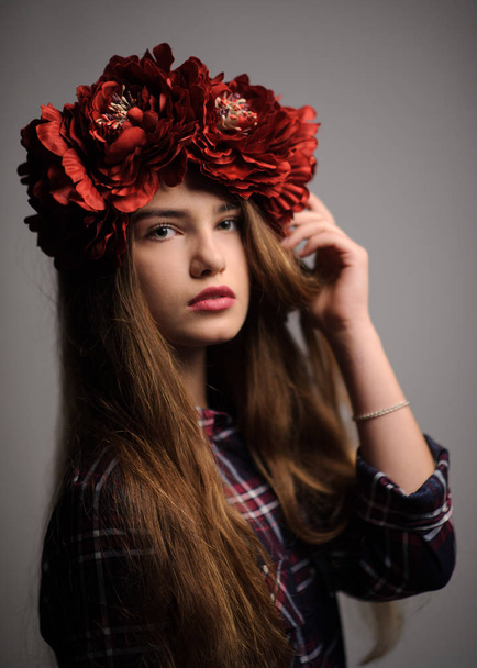 portrait of a beatiful girl with a wreath in studio - Photo, image