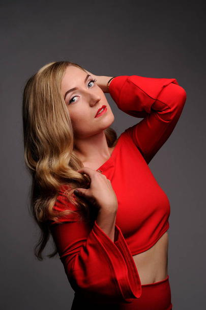 fashion picture of beautiful young blonde woman wearing red dres - Photo, image