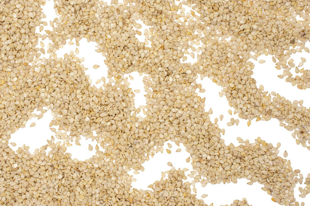 Unpeeled sesame seeds isolated on white - Foto, Bild
