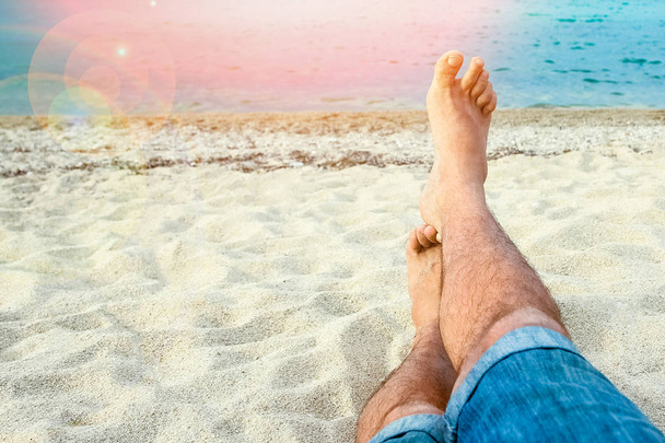 beautiful legs in the sand of the sea greece background - Foto, imagen