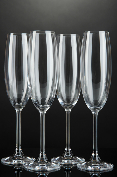 Empty glasses on grey background - Фото, изображение