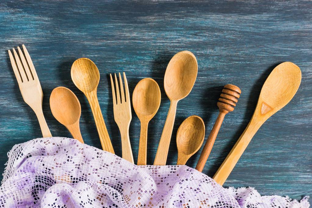 Wooden spoons on a vintage wooden background. Flat lay, top view, copy space. - Foto, immagini