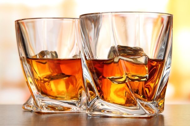 Glasses of whiskey, on bright background - Photo, Image