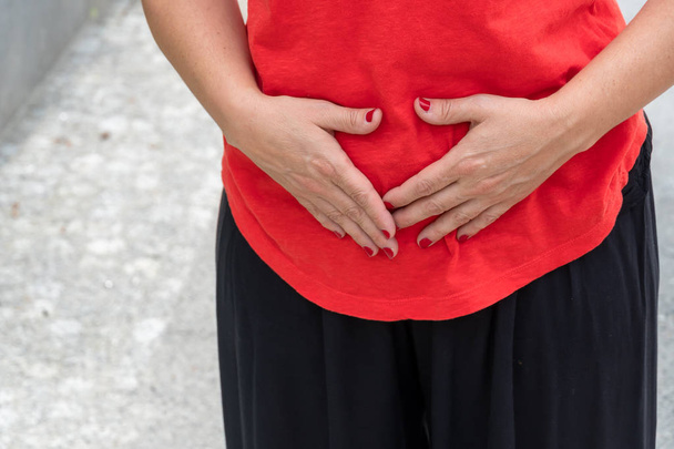 Stomach ache. Woman with menstrual pain. Selective focus - Photo, Image