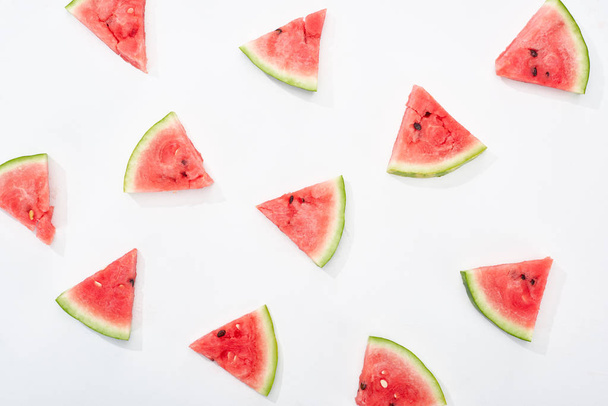 top view of fresh watermelon slices on white background - Fotó, kép