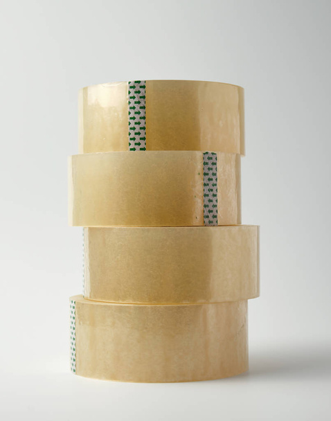 stack of transparent adhesive tape on a white background - Valokuva, kuva