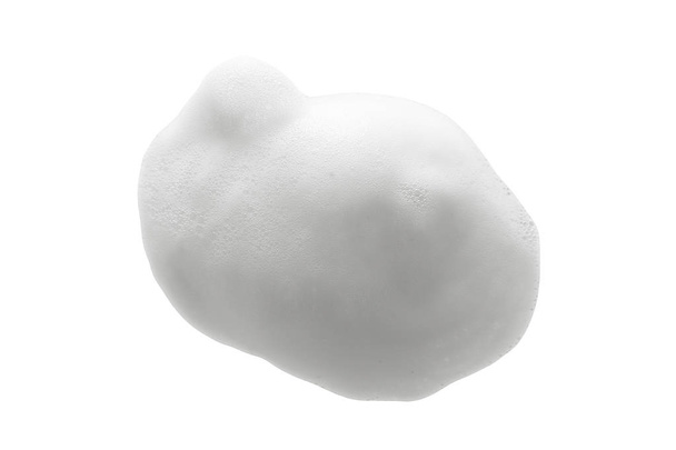 White cleanser foam texture isolated on white background. Cosmetic mousse, soap, shampoo bubbles. Macro, top view - Photo, Image