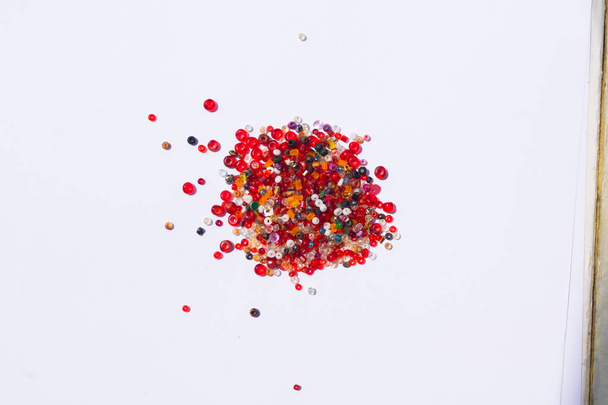 close up of colorful beads on a white background - Zdjęcie, obraz