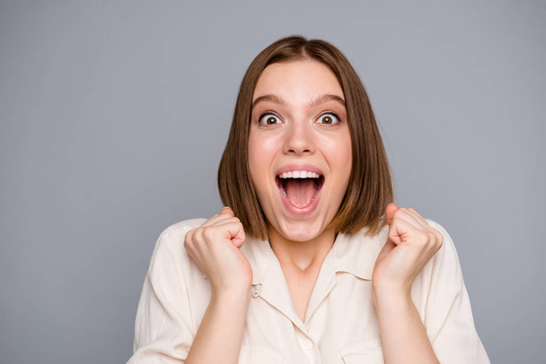 Close up photo of delighted ecstatic lady scream shout have aims champion yell shout unbelievable unexpected raise fists funny dressed blouse fashionable modern clothing isolated grey background - Photo, Image
