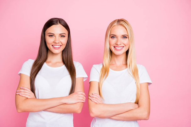 Photo of two ladies crossing hands wear casual outfit isolated pink background - Foto, afbeelding