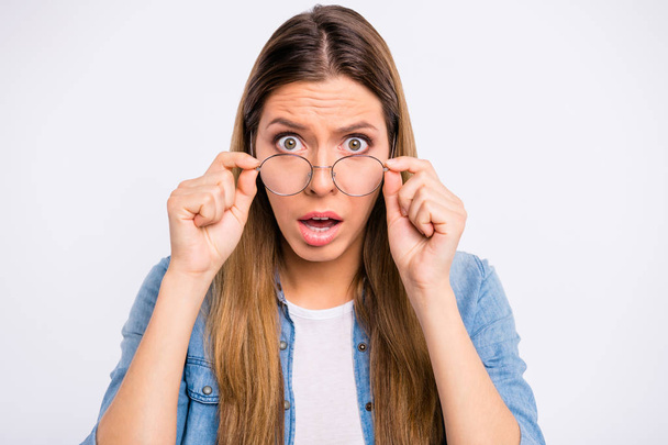 Close-up photo of scared terrified frightened pessimistic lady adjusting specs agent trader worker looking at you isolated grey background - Foto, Imagen