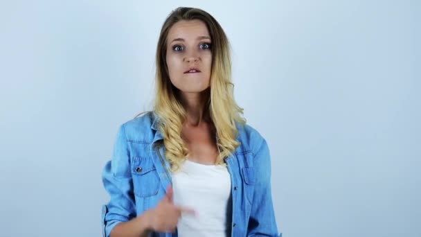 young beautiful sexy blonde woman shouting something negative abusive gesticulting with hands having argument on isolated white background - Video