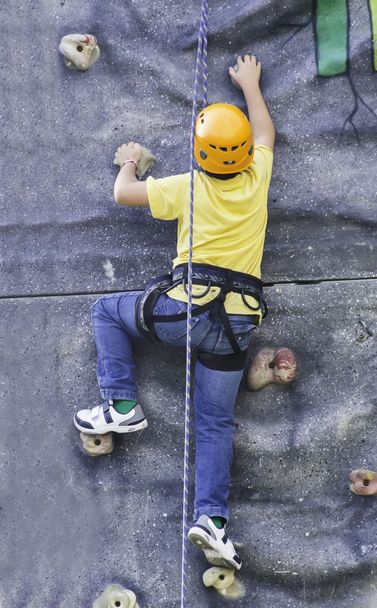 kind klimmen - Foto, afbeelding