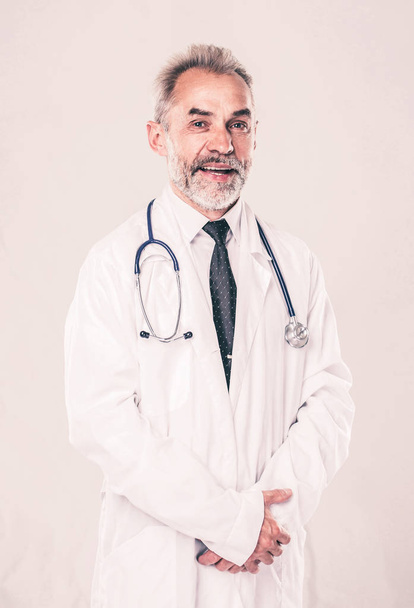 experienced therapist with a stethoscope on light background. - Photo, Image