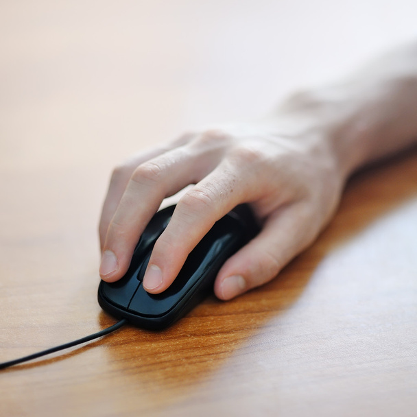 hand clicking on a computer mouse - Foto, Imagem