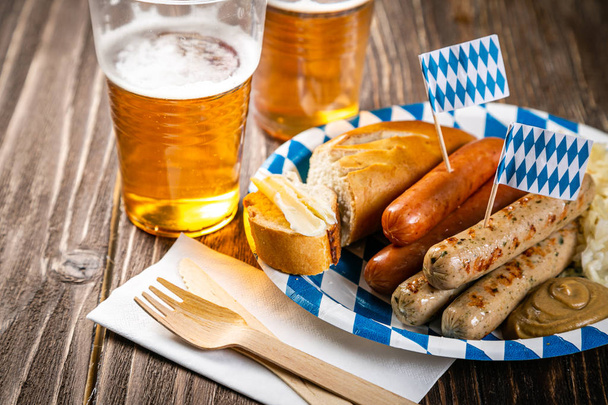 October fest concept - traditional food and beer served at event - Photo, Image