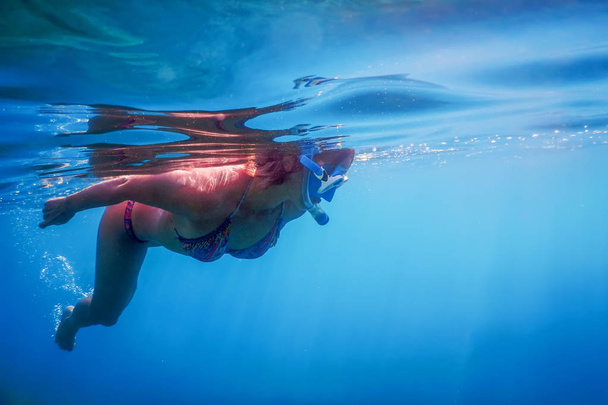 Women Snorkeling in the Tropical Sea, Underwater Women - 写真・画像