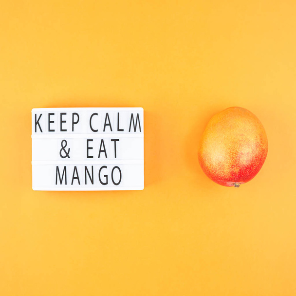 Mango fruit in creative composition - Фото, зображення