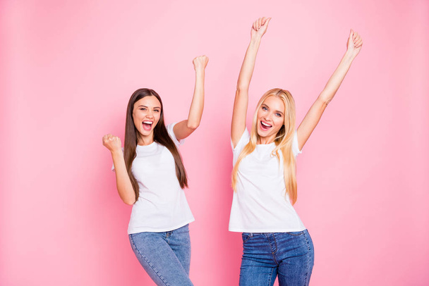 Photo of two ladies overjoyed by cool achievement wear casual outfit isolated pink background - Zdjęcie, obraz