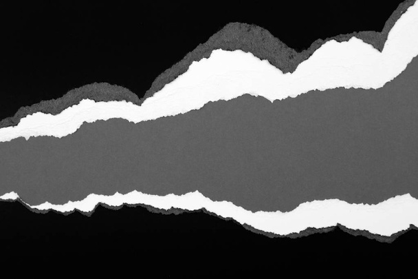 Розрізаний папір на сірому
 - Фото, зображення