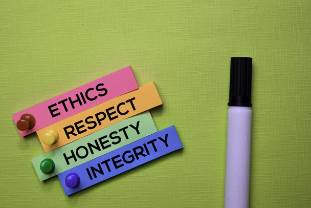 Ethics, Respect, Honesty, Integrity text on sticky notes isolated on green desk. Mechanism Strategy Concept - Photo, Image