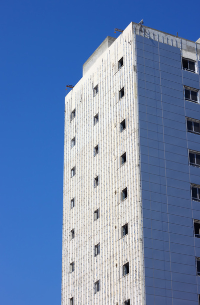 High-rise building construction against blue sky - Фото, зображення