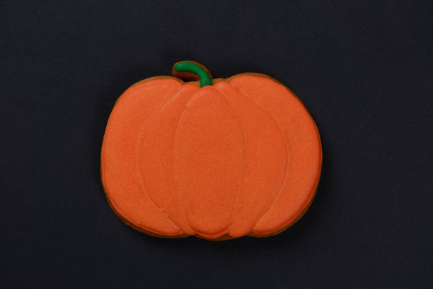The hand-made eatable Halloween pumpkin on black background - Photo, Image