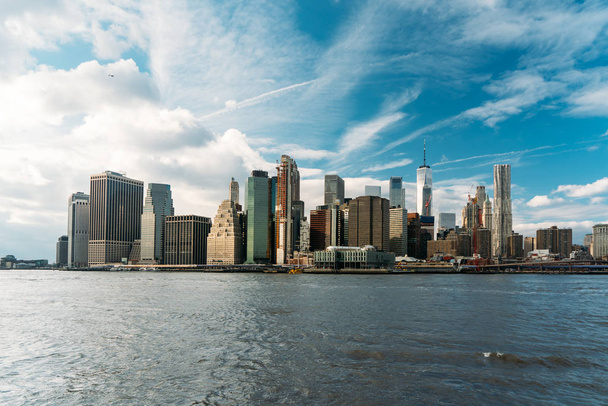 Colorful photo landscape of New York City with a clear blue sky and waves of the sea - Photo, Image
