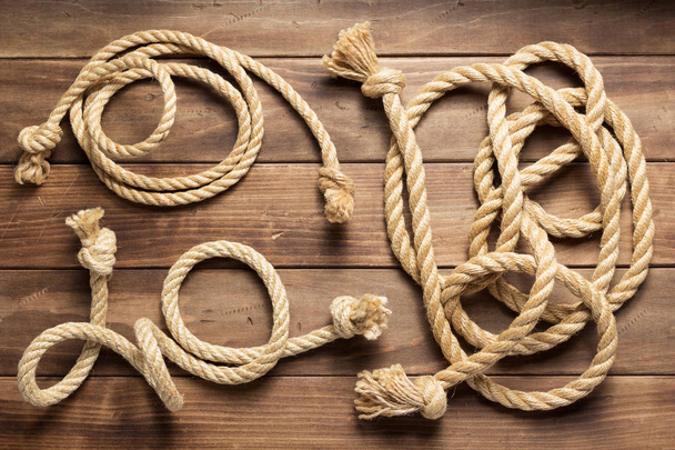 ship rope at wooden background texture - Foto, Imagem