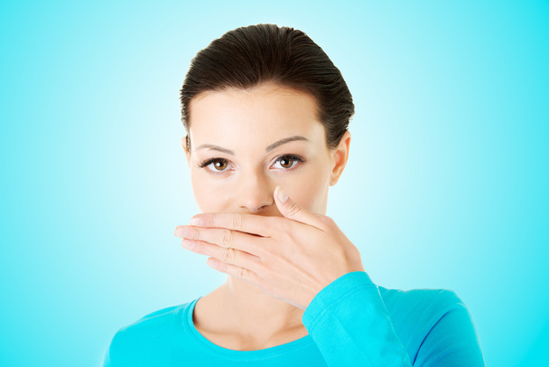 Woman covering mouth - Φωτογραφία, εικόνα