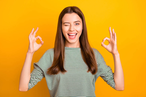 Photo of nice cute girl trying to become some prominent roman emperor and do several actions simultaneously while isolated with yellow background - Foto, Bild