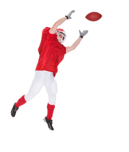 Portrait Of American Football Player Catching A Ball - Фото, изображение
