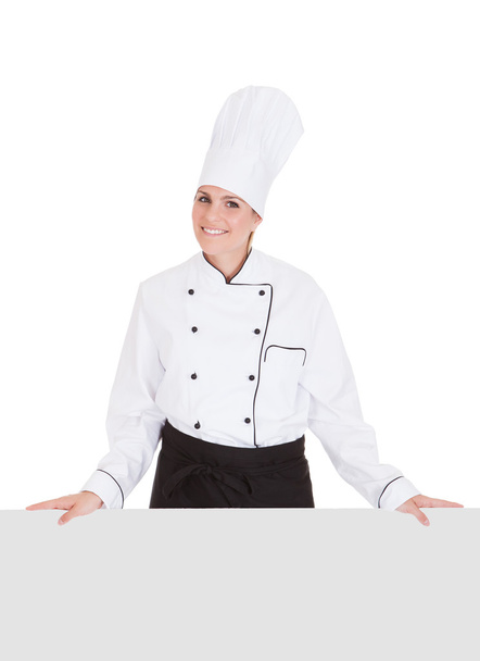 Female Chef Showing Blank Placard - 写真・画像