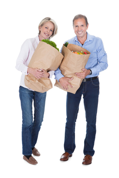 Mature Couple Holding Grocery - Foto, imagen