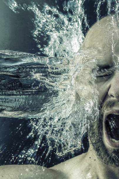 portrait of a man receiving a bucket of water in his face - Fotografie, Obrázek