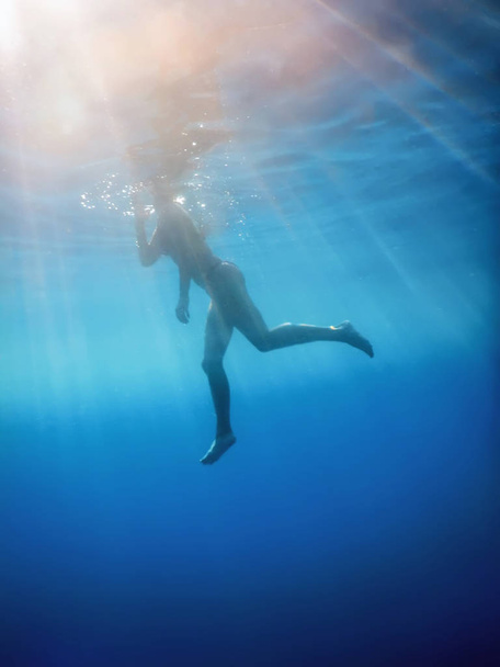 Woman in Bikini Underwater Perspective in the Tropical Sea - Photo, image