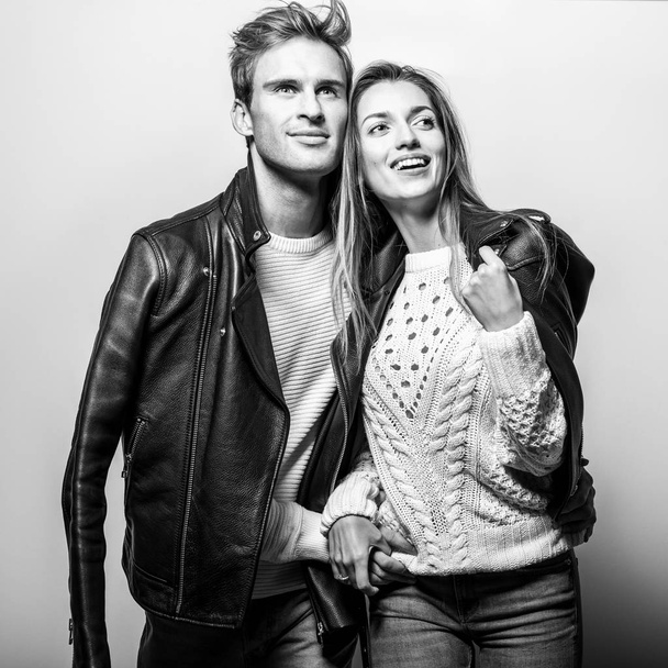 Young beautiful couple in black leather jackets. Black-white portrait. - Foto, Imagen