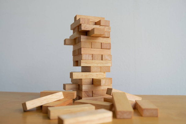 Wood block tower with architecture model, Concept Risk of management and strategy plan, growth business success process and team work - Foto, imagen