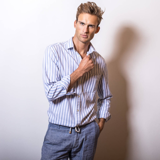Elegant young handsome man in stylish blue shirt. - Photo, Image
